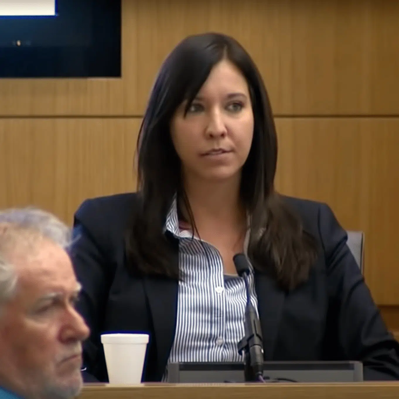 Dr. Janeen DeMarte on the witness stand providing expert testimony.